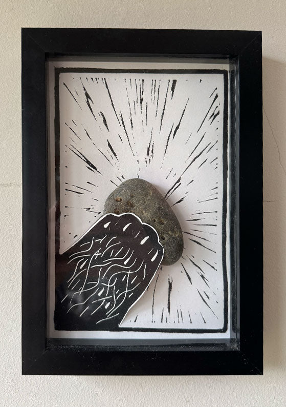 Framed A5 hand-printed black lino print 'Otter Paw' with a real unique stone.