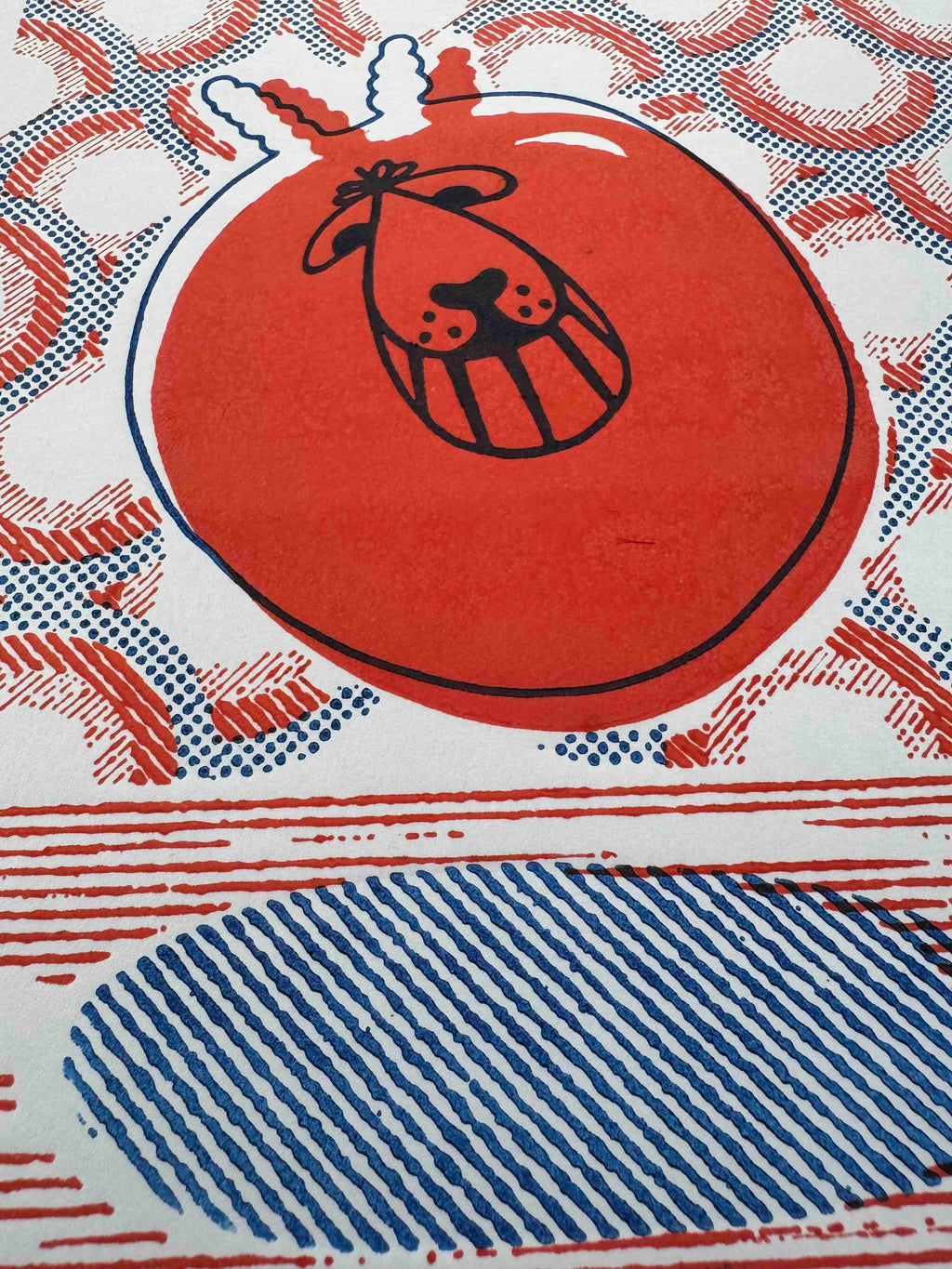 Detail of Space Hopper orange and blue hand-printed relief art print