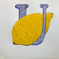Close up of U-Lemon hand-printed yellow and blue relief print showing ink texture.