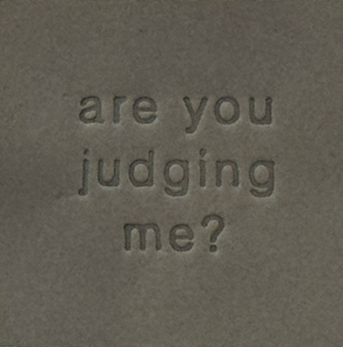 Surface Detail of original, minimalist, hand-embossed grey art card featuring the fun message ‘are you judging me?’