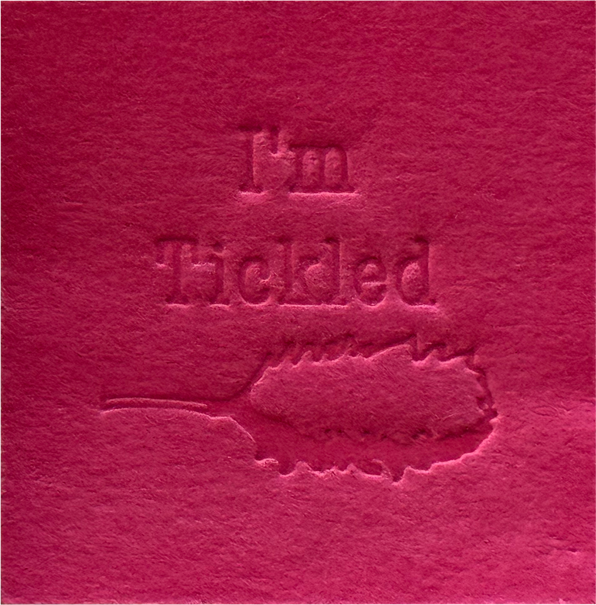 Surface Detail of original, minimalist, hand-embossed pink art card featuring the fun message ‘I’m Tickled’